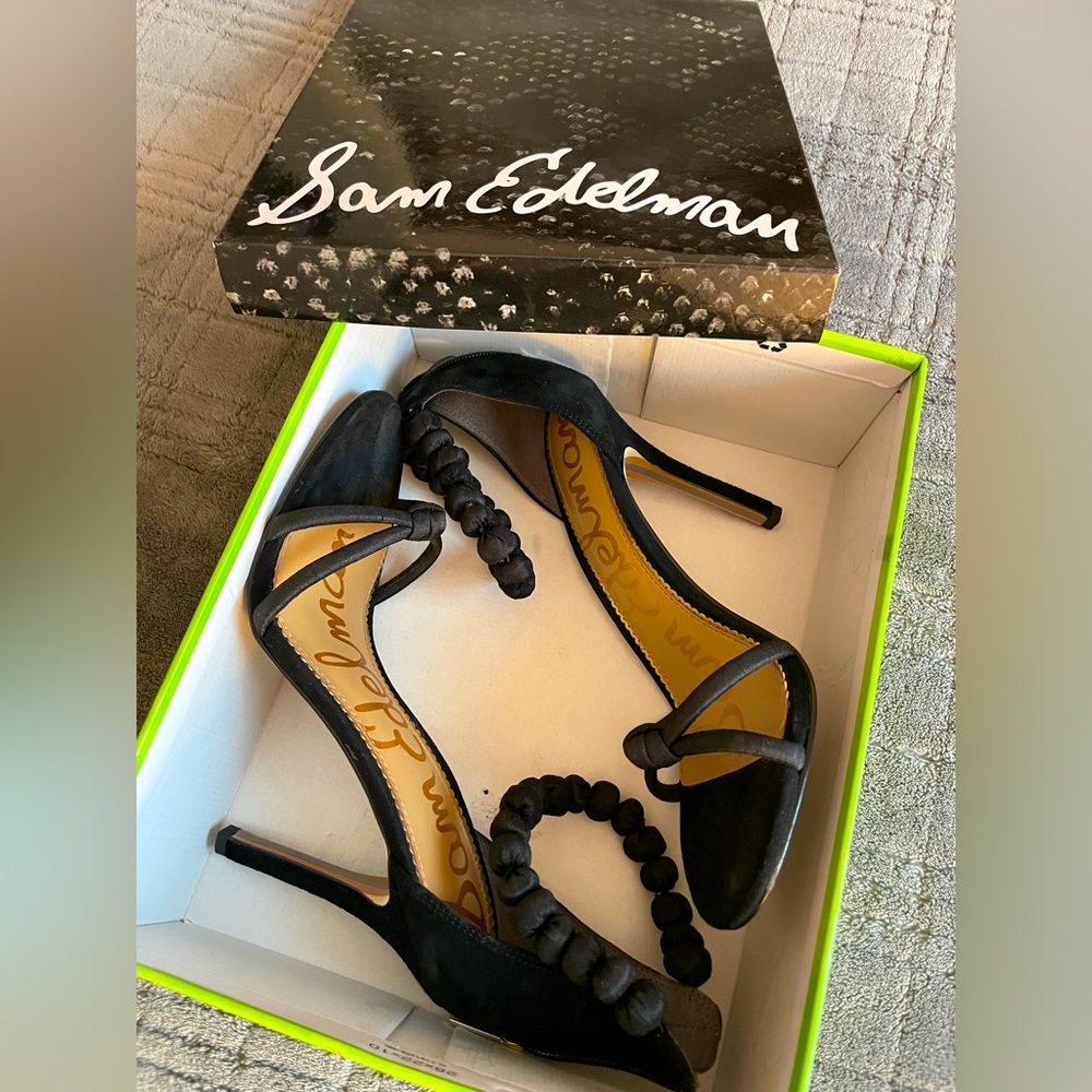 The Aria sandal from Sam Edelman flaunts modern elegance with its unique ankle .